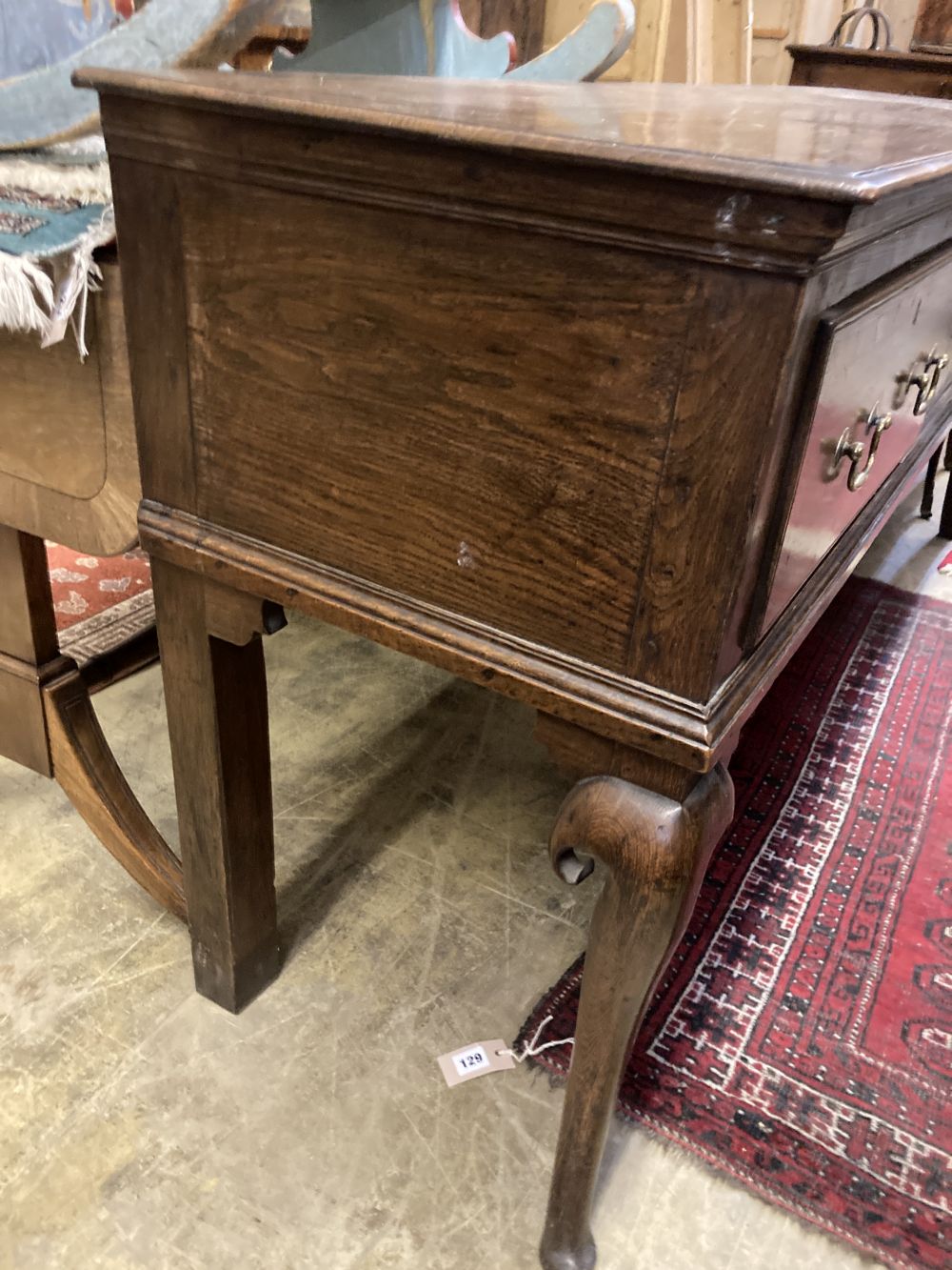 A mid 18th century oak low dresser, width 188cm depth 49cm height 83cm